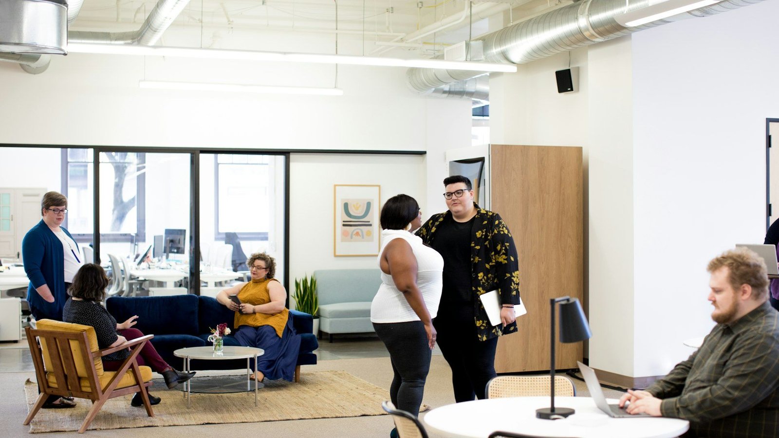 Colleagues working together in a bright open-plan office