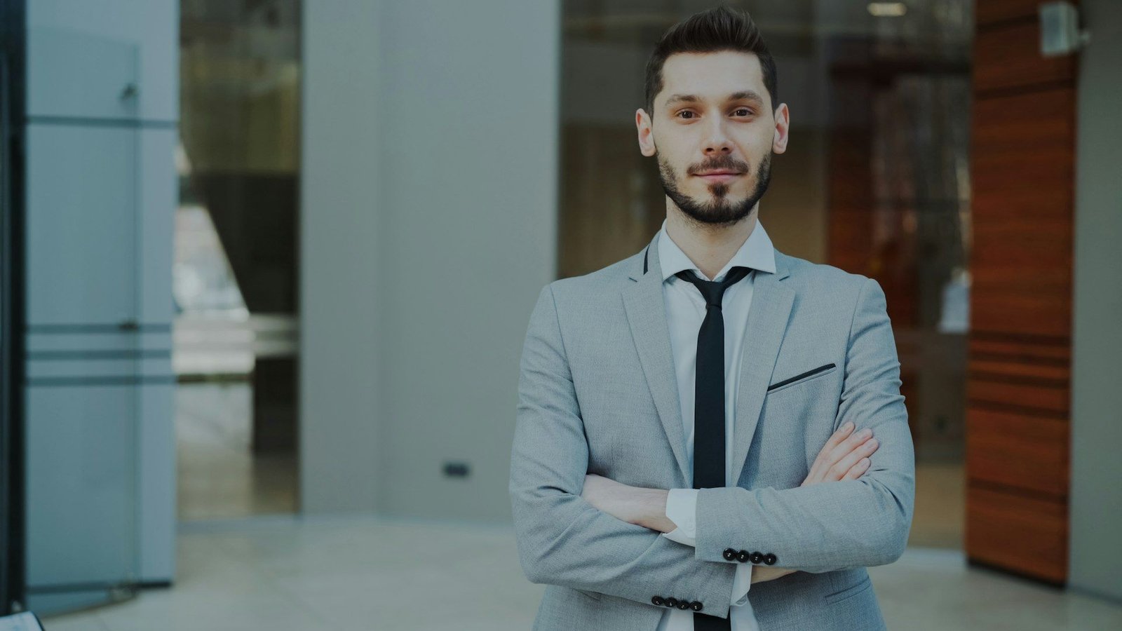 Businessman in a tailored suit in a bright modern office